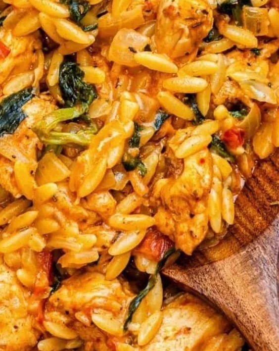 Cajun Chicken Orzo served on a plate with fresh herbs and spices
