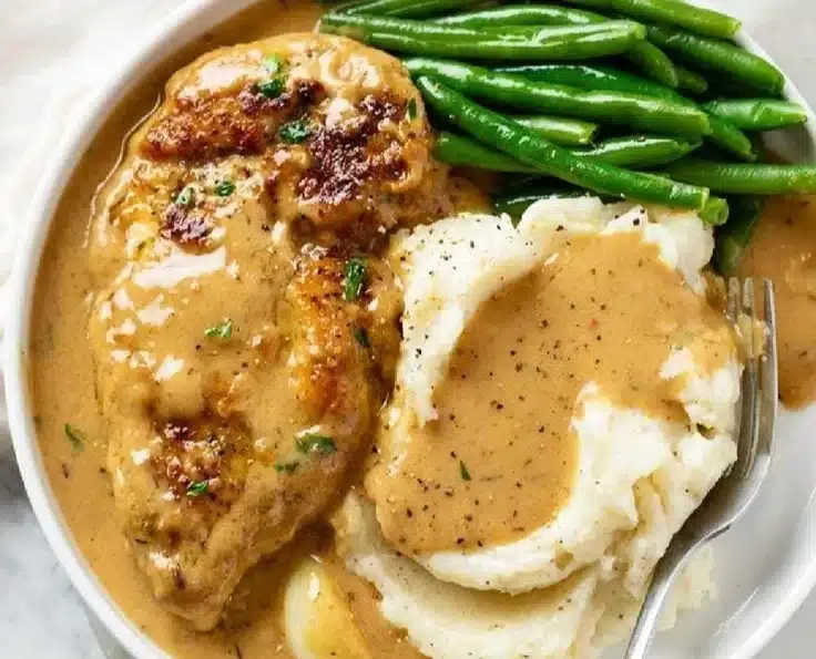 Delicious creamy garlic chicken served with herbs and vegetables