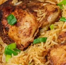 Delicious One Pot Chicken and Rice served in a bowl with vibrant vegetables