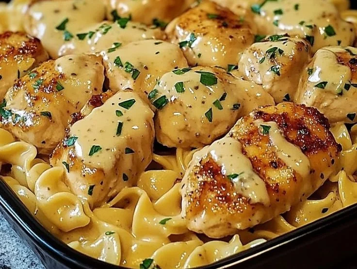 Easy one-pan chicken with buttered noodles on a plate