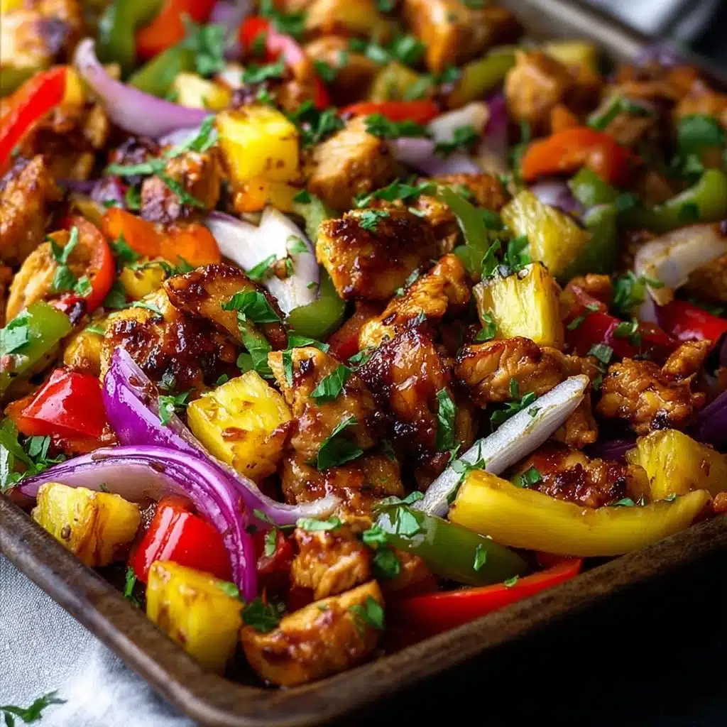 Hawaiian Chicken Sheet Pan with colorful vegetables and pineapple