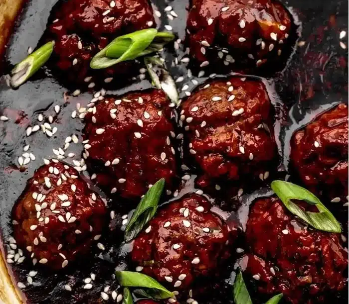 Plate of Sticky Mongolian Beef Meatballs garnished with green onions