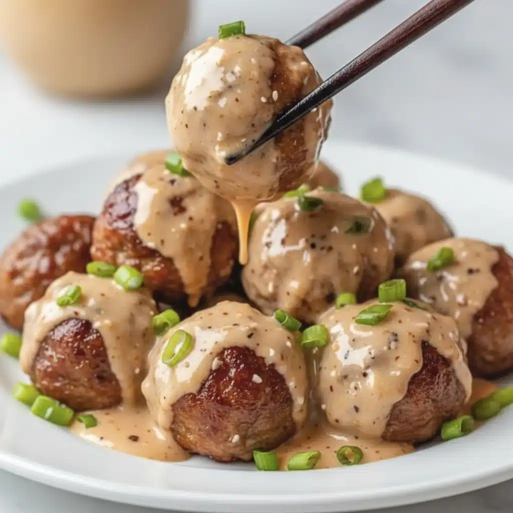 Korean BBQ meatballs garnished with sesame seeds and herbs